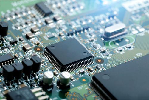 closeup-electronic-circuit-board-with-cpu-microchip-electronic-components-background