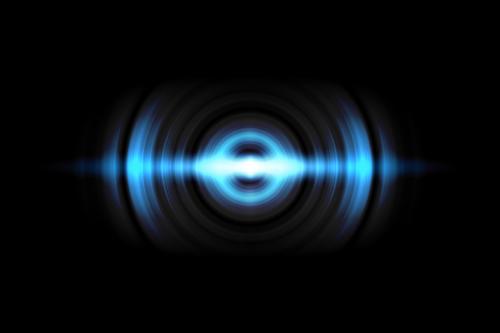 abstract-light-blue-circle-effect-with-sound-waves-oscillating-black-background